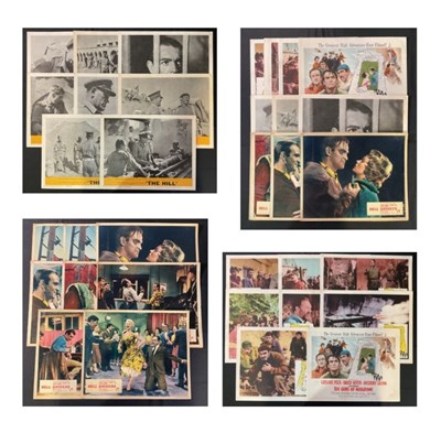 Lot 111 - A group of 11” x 14” lobby cards for THE GUNS...