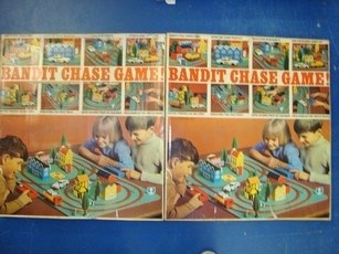 Lot 106 - VINTAGE TOYS: A pair of Bandit chase games by...