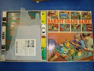 Lot 106 - VINTAGE TOYS: A pair of Bandit chase games by...