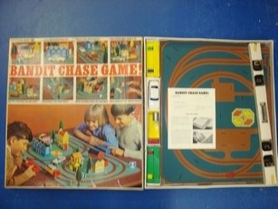 Lot 106 - VINTAGE TOYS: A pair of Bandit chase games by...