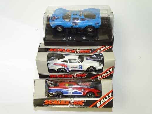 Lot 113 - VINTAGE TOYS: A group of boxed SCALEXTRIC cars...