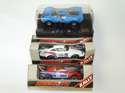 Lot 113 - VINTAGE TOYS: A group of boxed SCALEXTRIC cars...