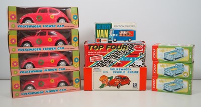 Lot 186 - A group of plastic and tinplate vehicles made...