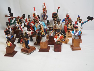 Lot 266 - A regiment of painted resin sculptures and...