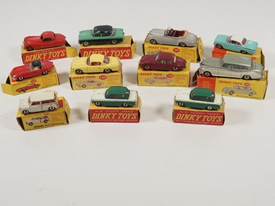 Lot 291 - A group of boxed DINKY diecast cars comprising...