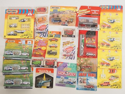 Lot 349 - A quantity of modern carded diecast vehicles...