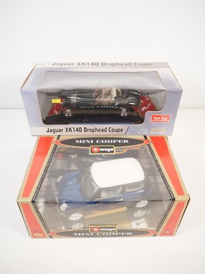 Lot 414 - 1:18 scale diecast cars comprising a SUNSTAR...