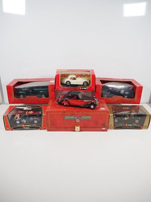 Lot 456 - A group of 1:18 and 1:24 scale diecast cars by...