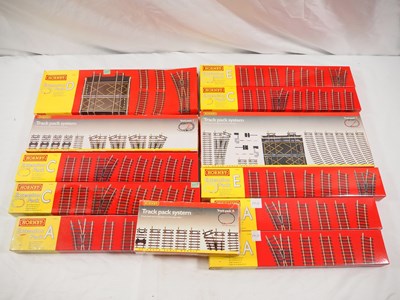 Lot 254 - HORNBY - a group of OO gauge track packs,...