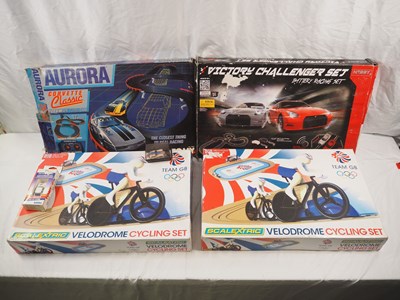 Lot 507 - A group of slot racing sets comprising 2x...