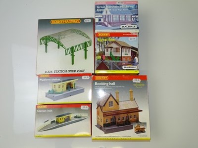 Lot 374 - OO GAUGE MODEL RAILWAYS: A group of buildings...