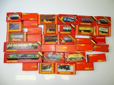 Lot 589 - OO GAUGE MODEL RAILWAYS: A group of wagons by...