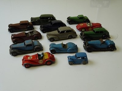 Lot 85 - DINKY: A group of playworn DINKY cars as...