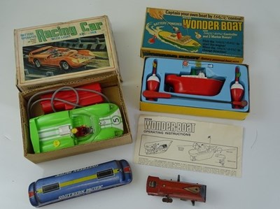 Lot 91 - VINTAGE TOYS: A battery operated MARX racing...