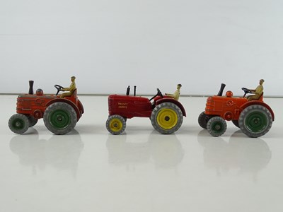 Lot 101 - A group of CORGI and DINKY tractors and...