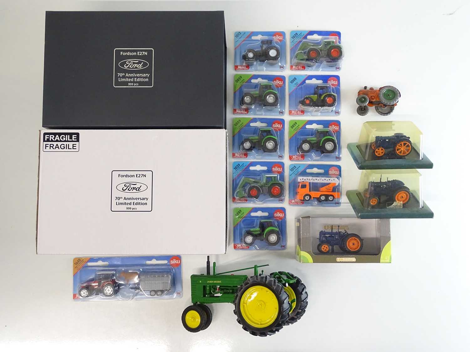 Lot 13 - A group of diecast tractor models to include a...
