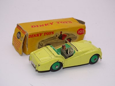 Lot 136 - A DINKY Toys 105 Triumph TR2 (Touring Finish)...