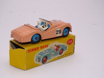 Lot 137 - A DINKY Toys 111 Triumph TR2 (Competition...