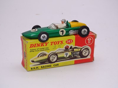 Lot 146 - A DINKY Toys 243 BRM Racing Car in dark...