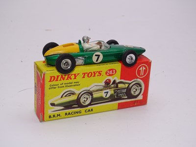 Lot 146 - A DINKY Toys 243 BRM Racing Car in dark...