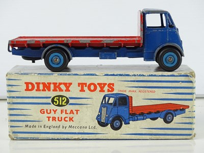Lot 158 - A DINKY Toys 512 Guy Flat Truck - with dark...