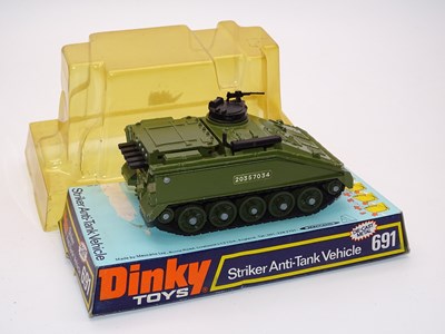 Lot 166 - A DINKY Toys 691 - Striker Anti-Tank Vehicle -...