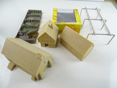 Lot 523 - A small group of mainly resin cast buildings...