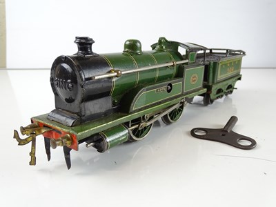 Lot 550 - A BING 0-4-0 clockwork steam locomotive and...