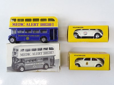 Lot 59 - A small group of diecast vehicles comprising...