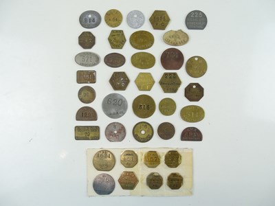 Lot 185 - A large quantity of brass and metal pay tokens...