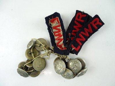 Lot 187 - A quantity of buttons and cloth jacket badges...