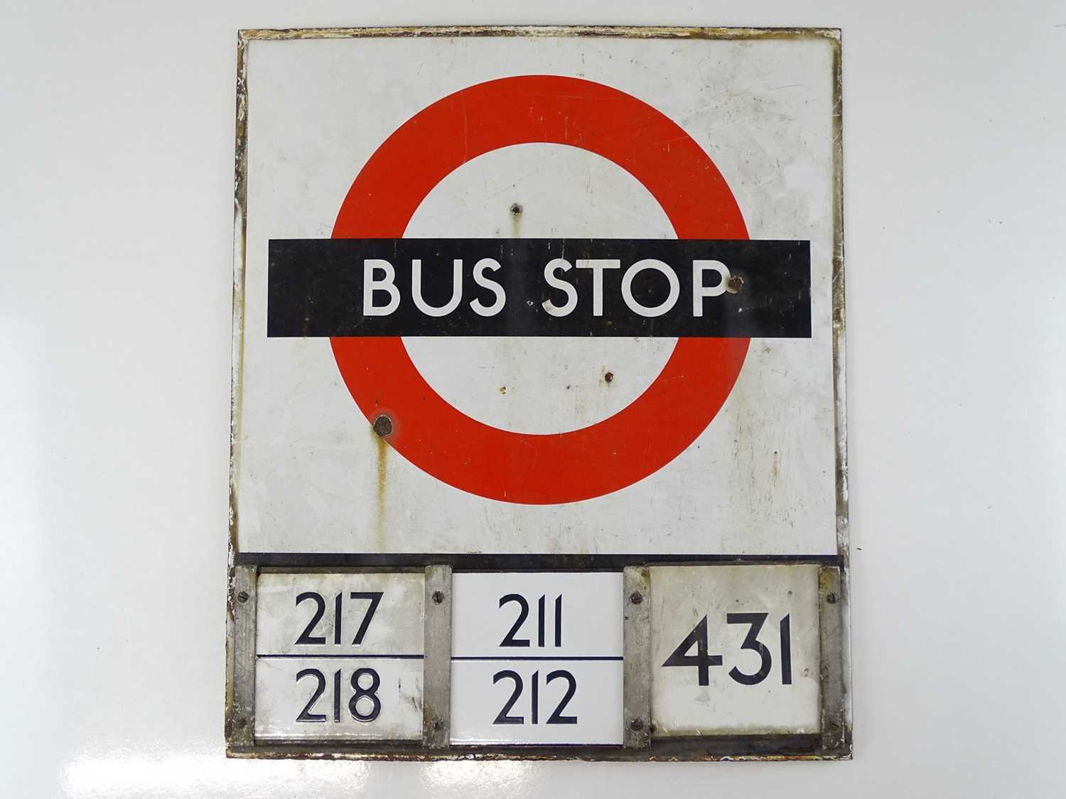 Lot 213 - A London Transport 'roundel' enamel bus stop...