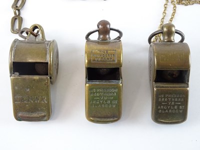 Lot 65 - A group of brass Thunderer Patent whistles all...