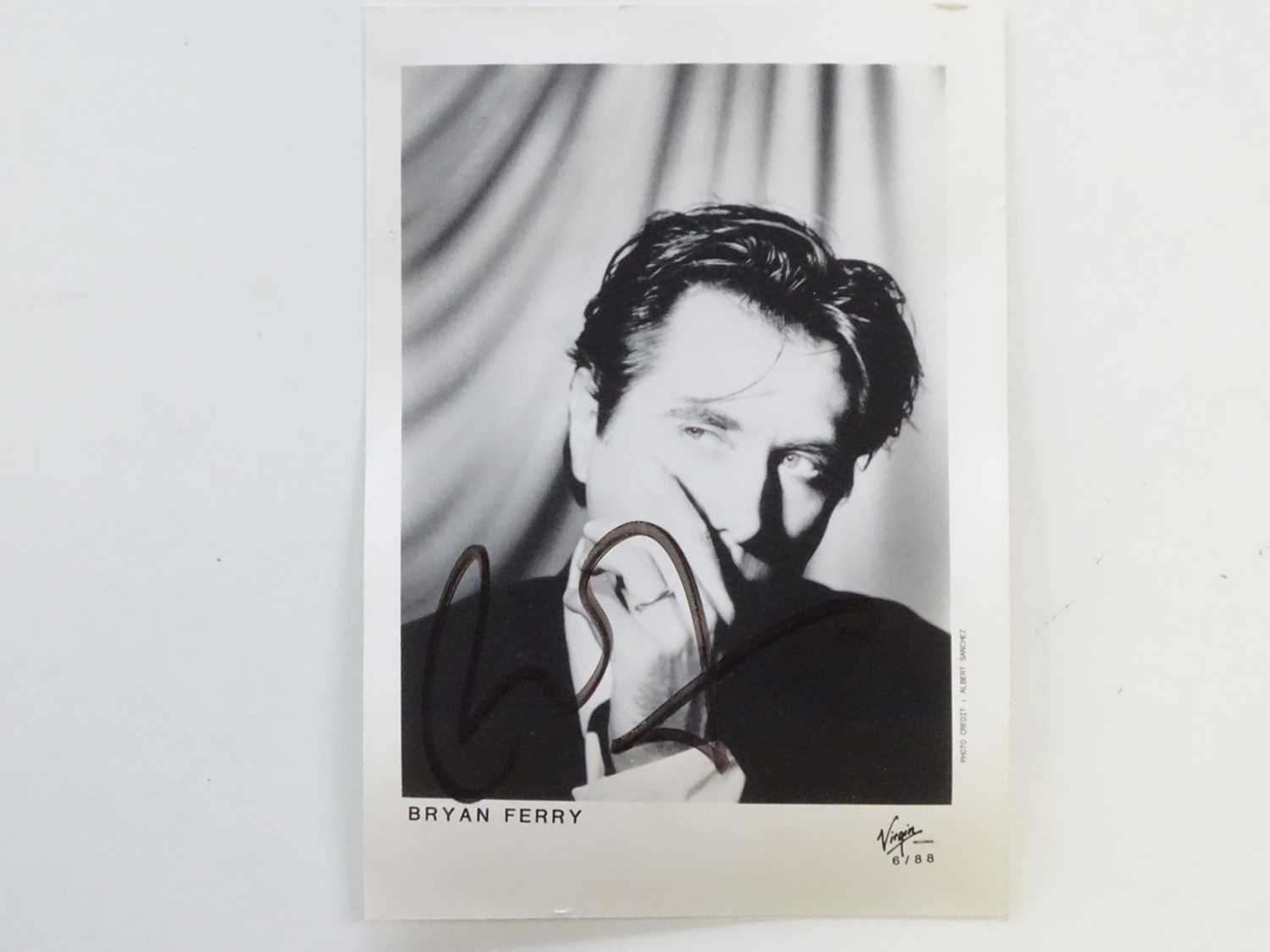 Lot 472 - BRYAN FERRY: A signed black/white photograph...