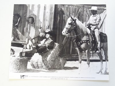 Lot 57 - WESTERNS: A selection of black/white stills...