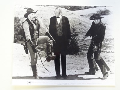Lot 57 - WESTERNS: A selection of black/white stills...