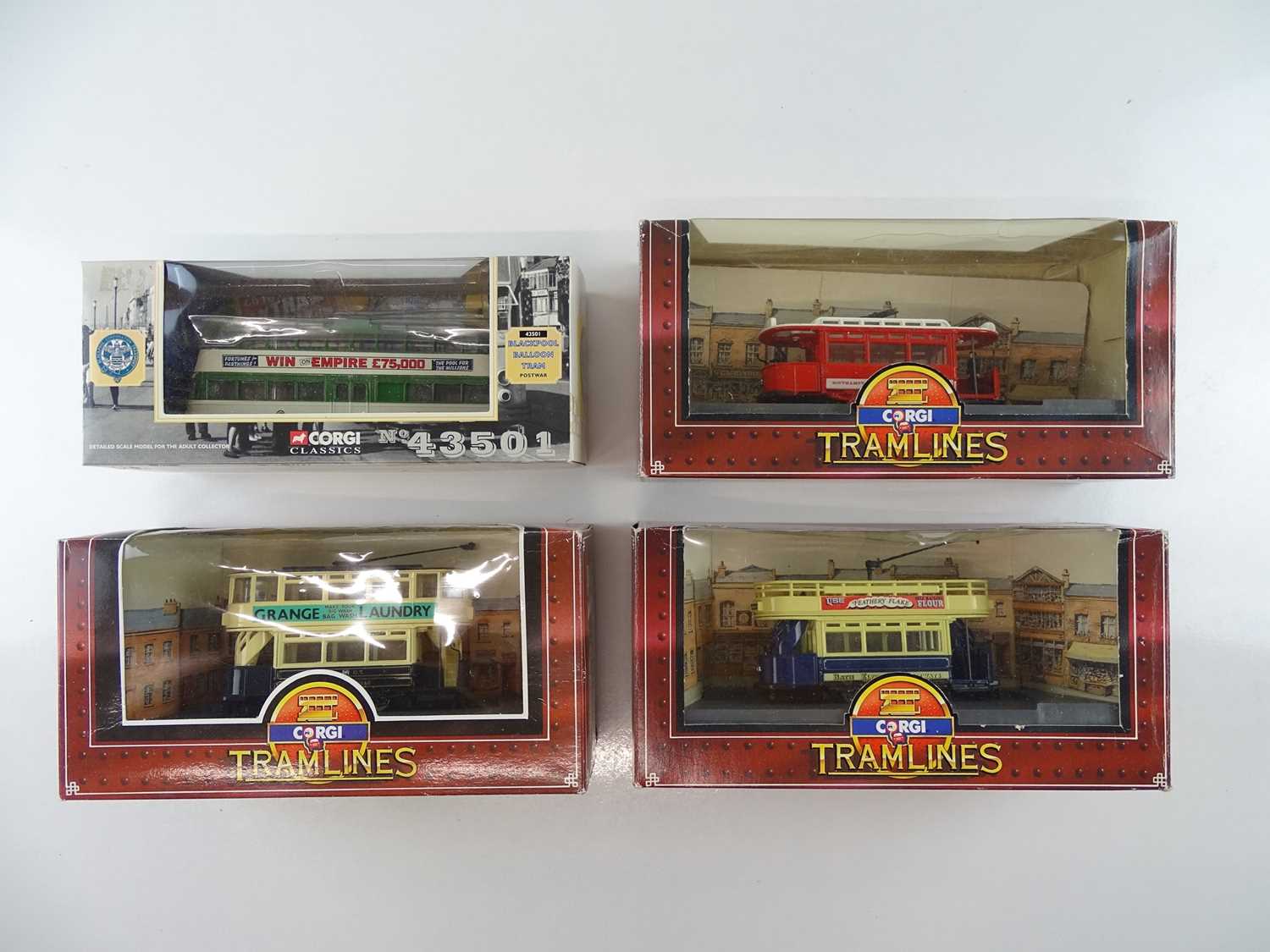Lot 1 - A small group of CORGI diecast trams in...