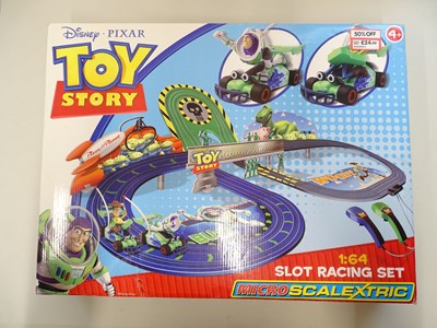 Lot 113 - A MICRO SCALEXTRIC Toy Story slot racing set,...