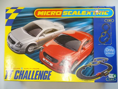 Lot 114 - A MICRO SCALEXTRIC TT Challenge slot racing...