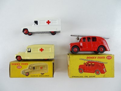 Lot 29 - A pair of DINKY 253 Daimler Ambulances in...