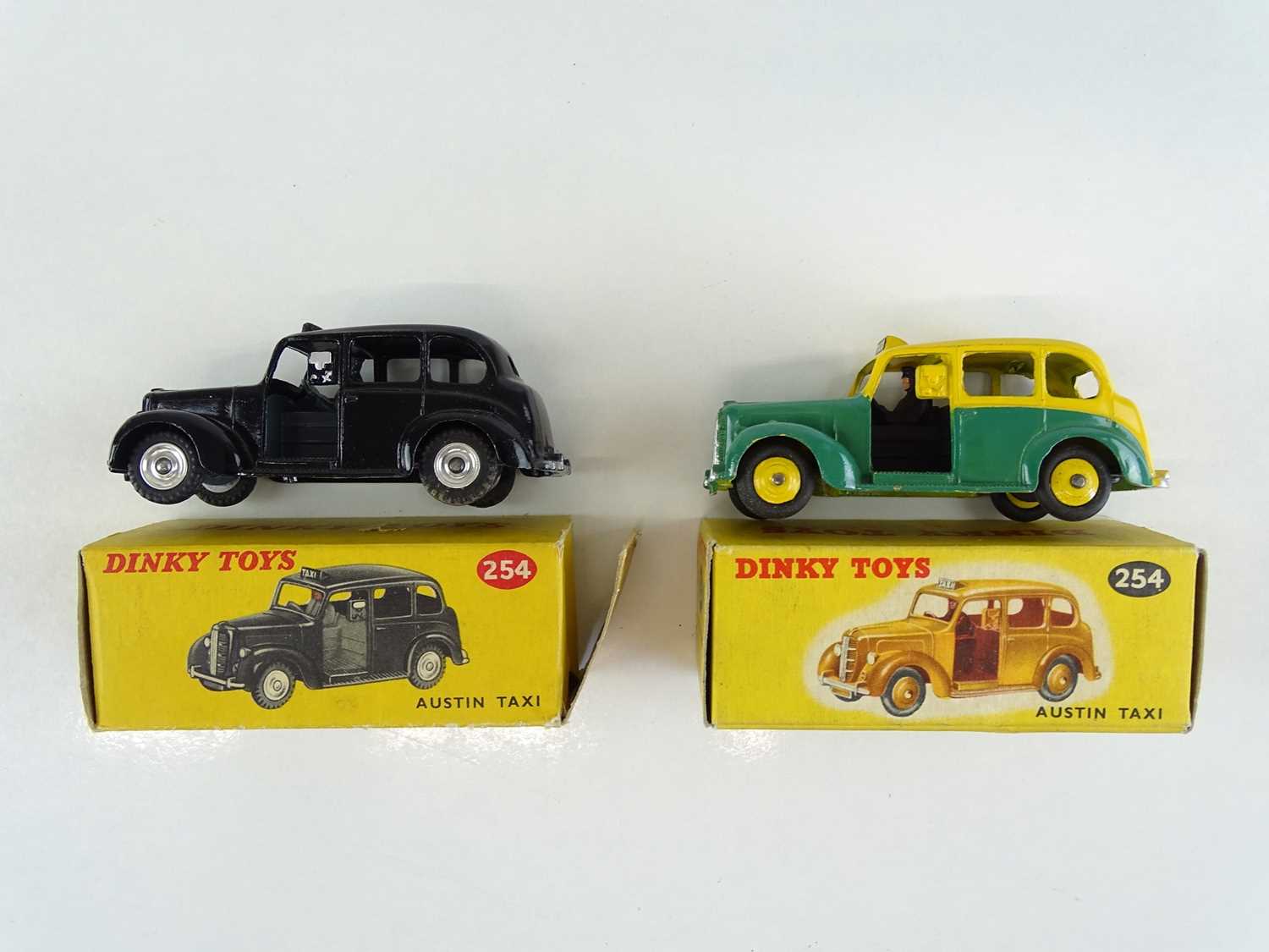 Lot 41 - A pair of DINKY 254 Austin Taxis in black and...
