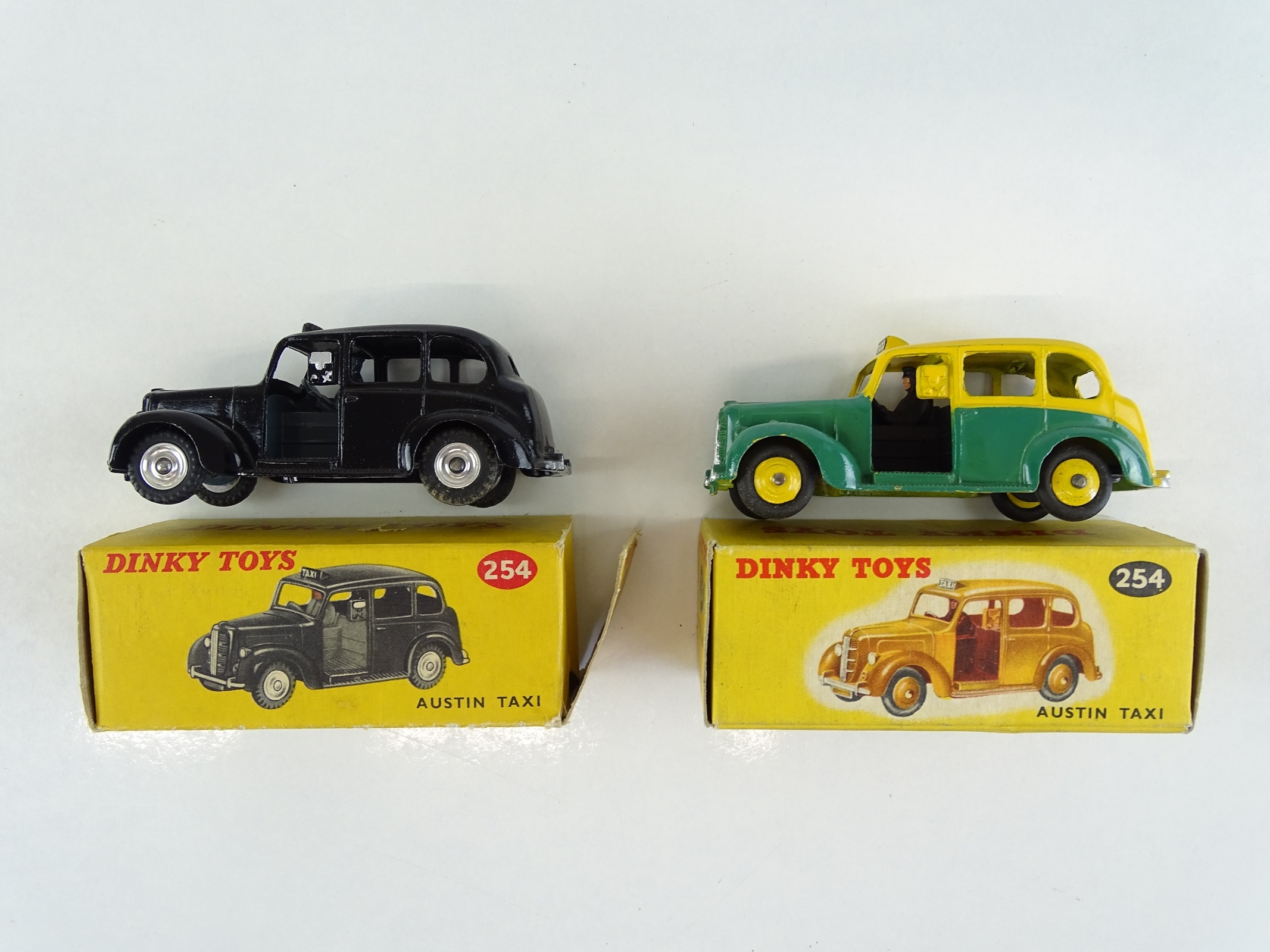 Lot 41 - A pair of DINKY 254 Austin Taxis in black and