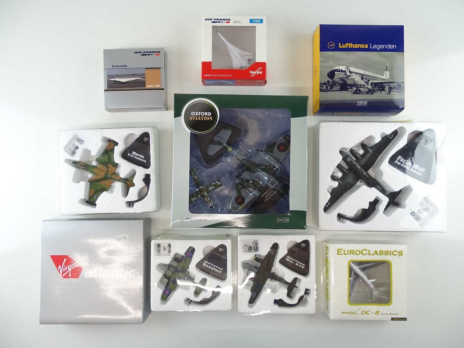 Lot 8 - A mixed group of diecast airplanes in various...